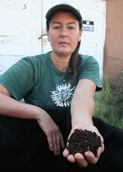 Amy Larsen Holding a Hand of Finished Johnson-Su Bioreactor Compost
